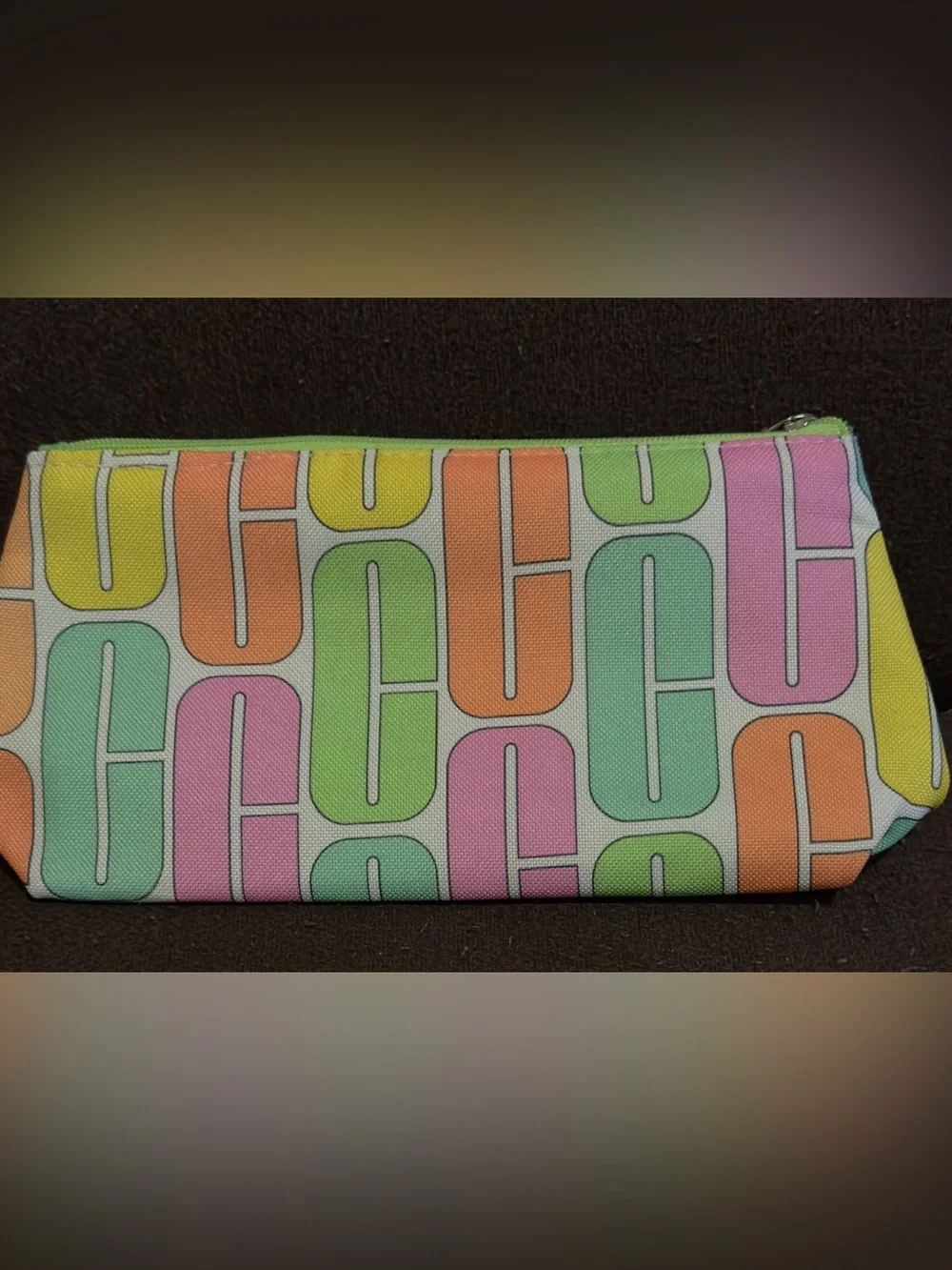 NWOT Clinique Pastel Geo Print Cosmetic Pouch - Multicolor. 9”W x 5”H.